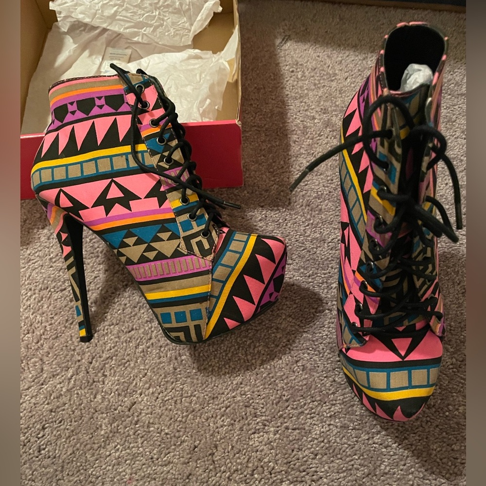 Pink platform aztec print booties.